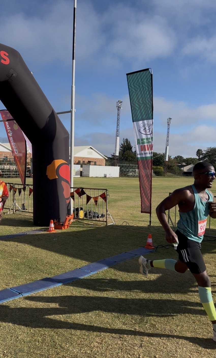 Athlete running through a race finish area